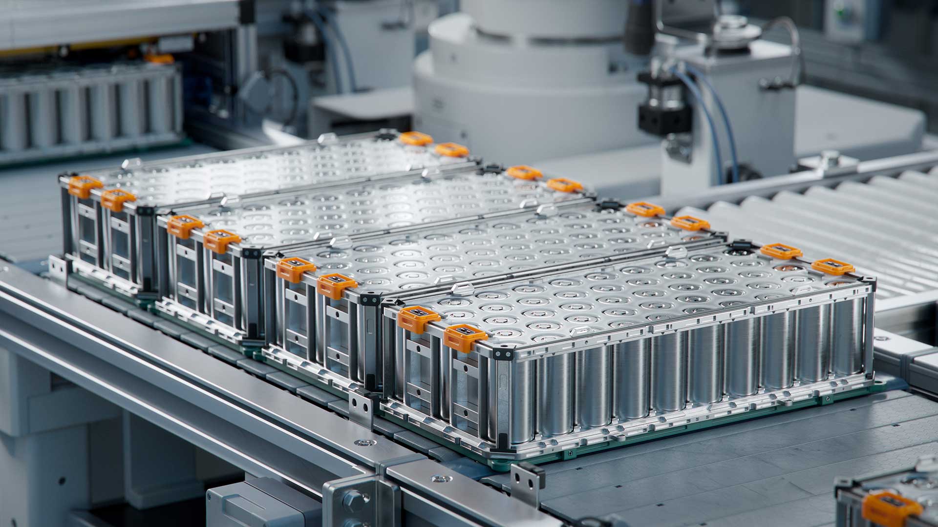 EV battery modules with welded Li-ion cells on a conveyor belt